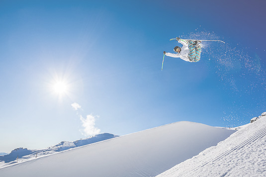 Freestyle skier Kentaro Tsuda jumping out of the halfpipe at Cardrona alpine ski resort, Action Sports Photography
