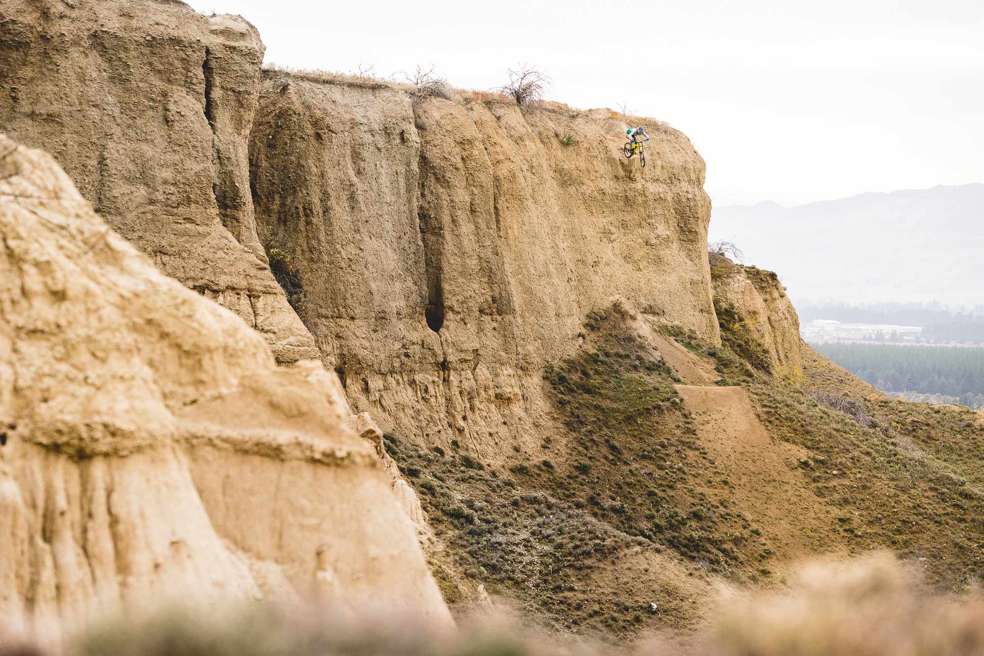 Mountain biker Conor macfarlane huge cliff drop in New Zealand