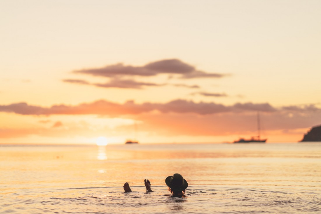 Laying in the ocean while watching sun set on the horizon on Great Barrier Island in New Zealand. Photo by Sony Ambassador Stefan Haworth