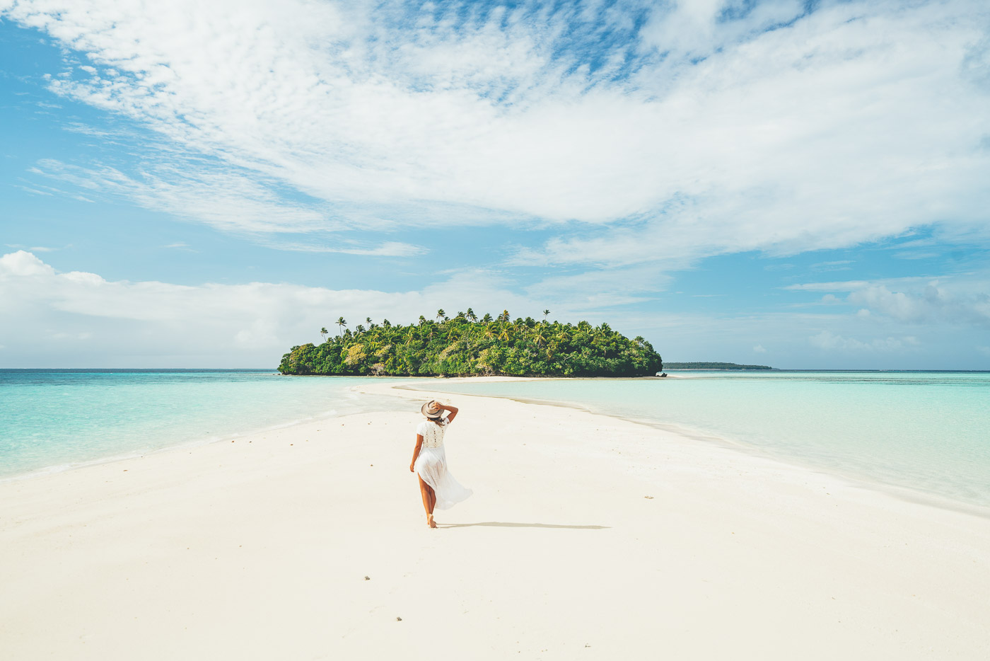 girl walking on white sand beaches of Vava'u Tonga