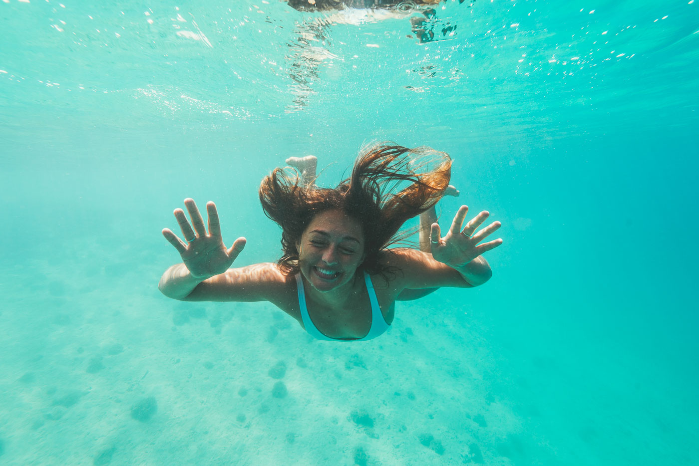 girl swimming in white sand beaches of Vava'u Tonga