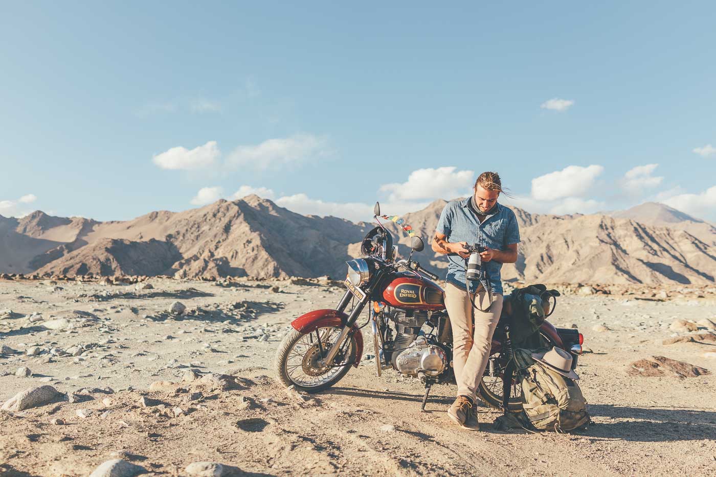 Photographer Stefan Haworth riding a Royal Enfield Motorbike through the Indian Himalayas