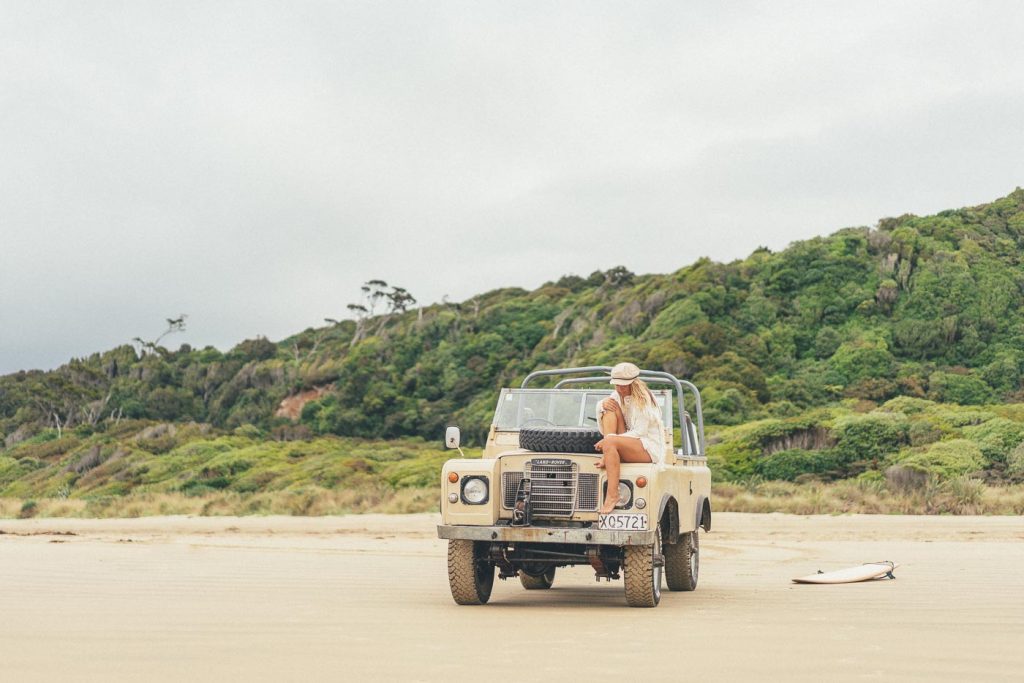 Jess Davis sitting on the front of Peanut, Stefan Haworth's Land Rover