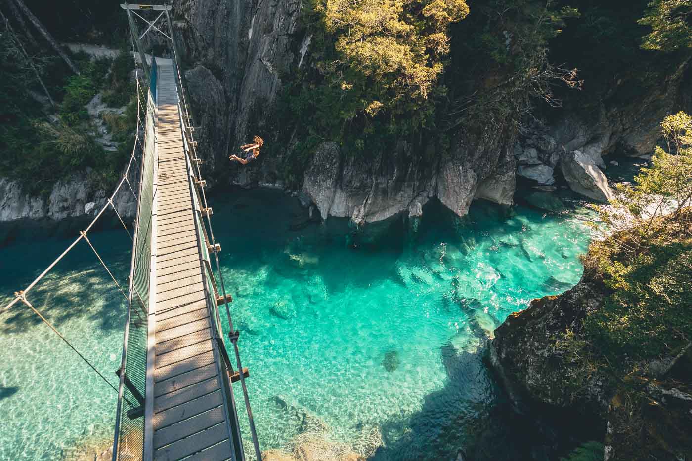 Alexander Knorr jumping off the Blue pool bridge in New Zealand on the Will and Bear Road trip