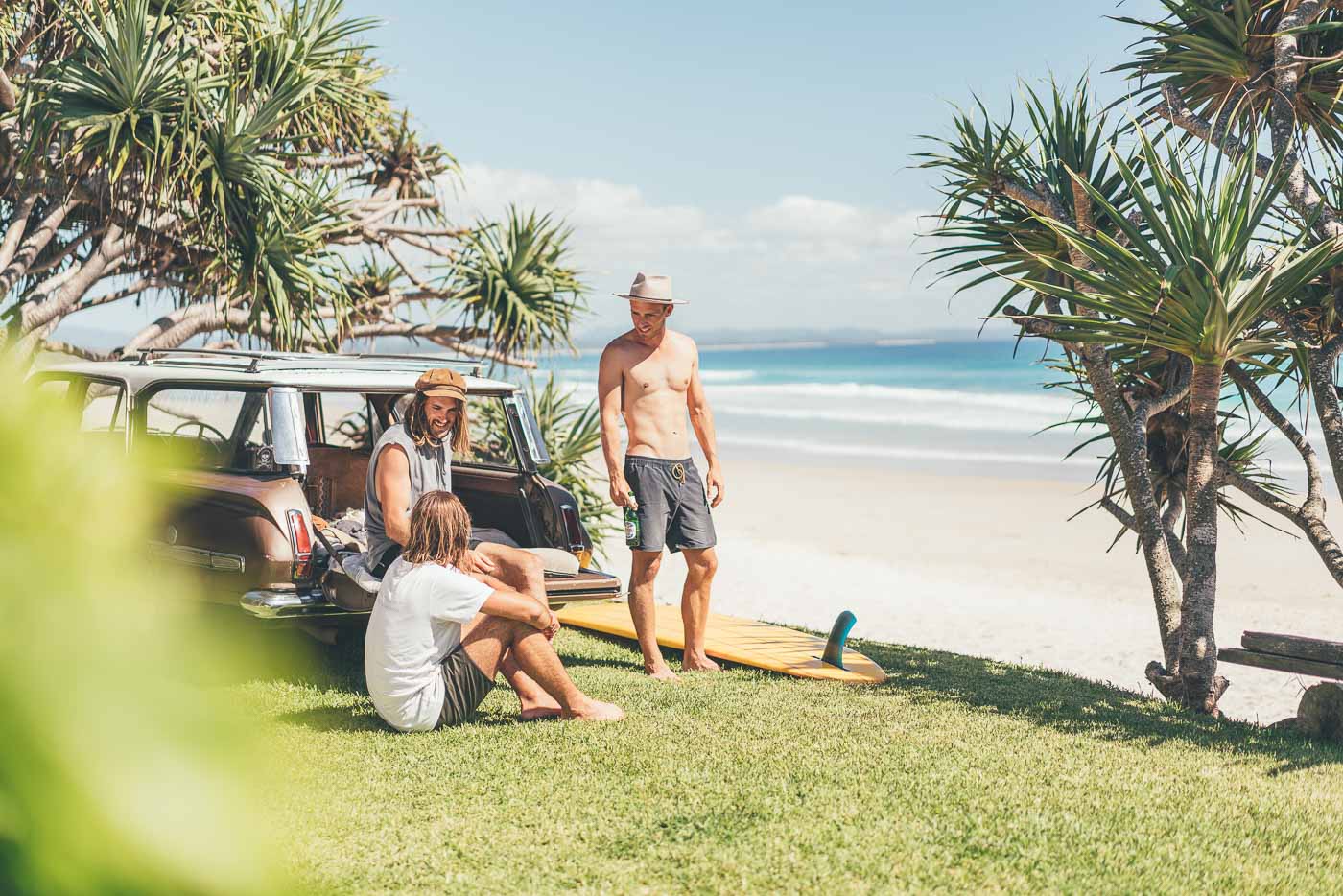 Hanging at the back of a vintage car after a surf at Byron Bay