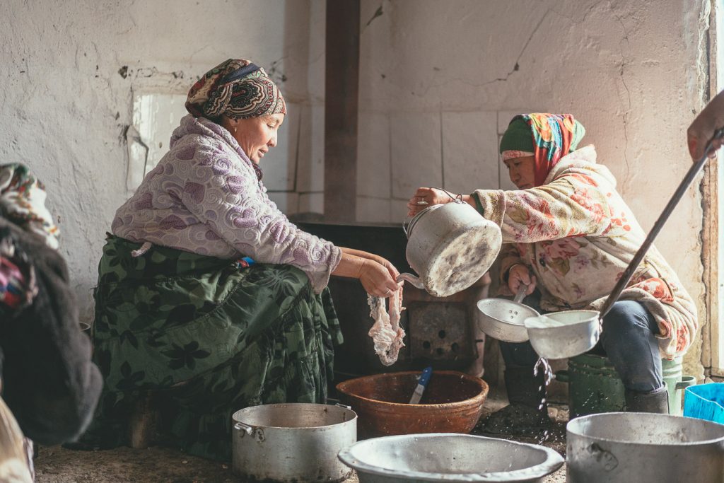 Mongolian mothers cleaning out the animal intestine's for cook during the winter slaughter in Mongolia. Captured by Sony ambassador and photographer Stefan Haworth