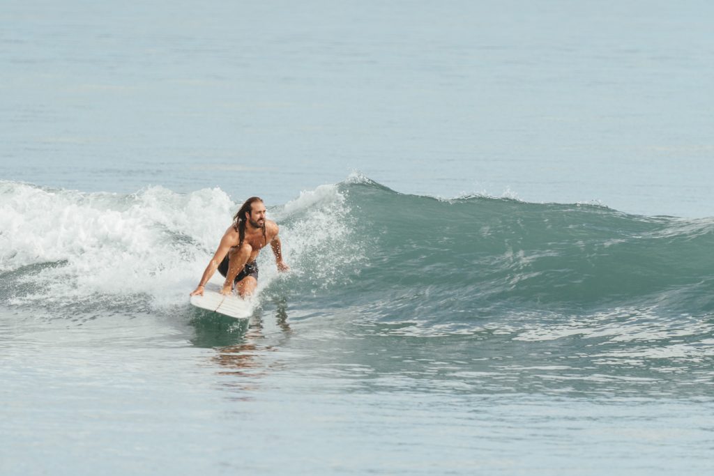 Photographer Stefan Haworth surfing in Jackson Bay on the West Coast of New Zealand