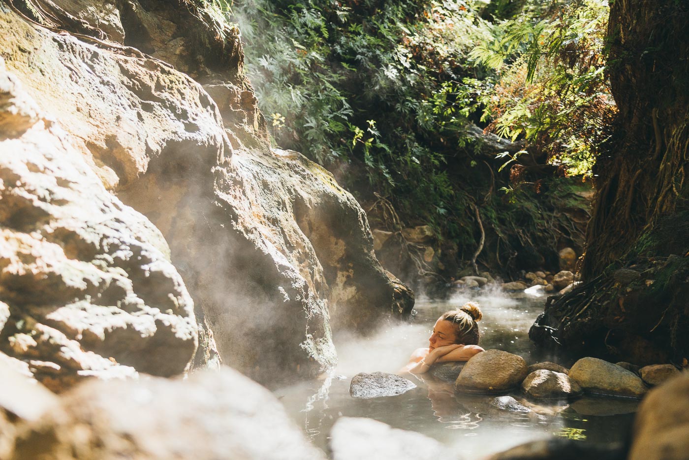 Jade Barclay relaxing in in the natural thermal hot pools of Great barrier Island. Captured by adventure Photographer Stefan Haworth