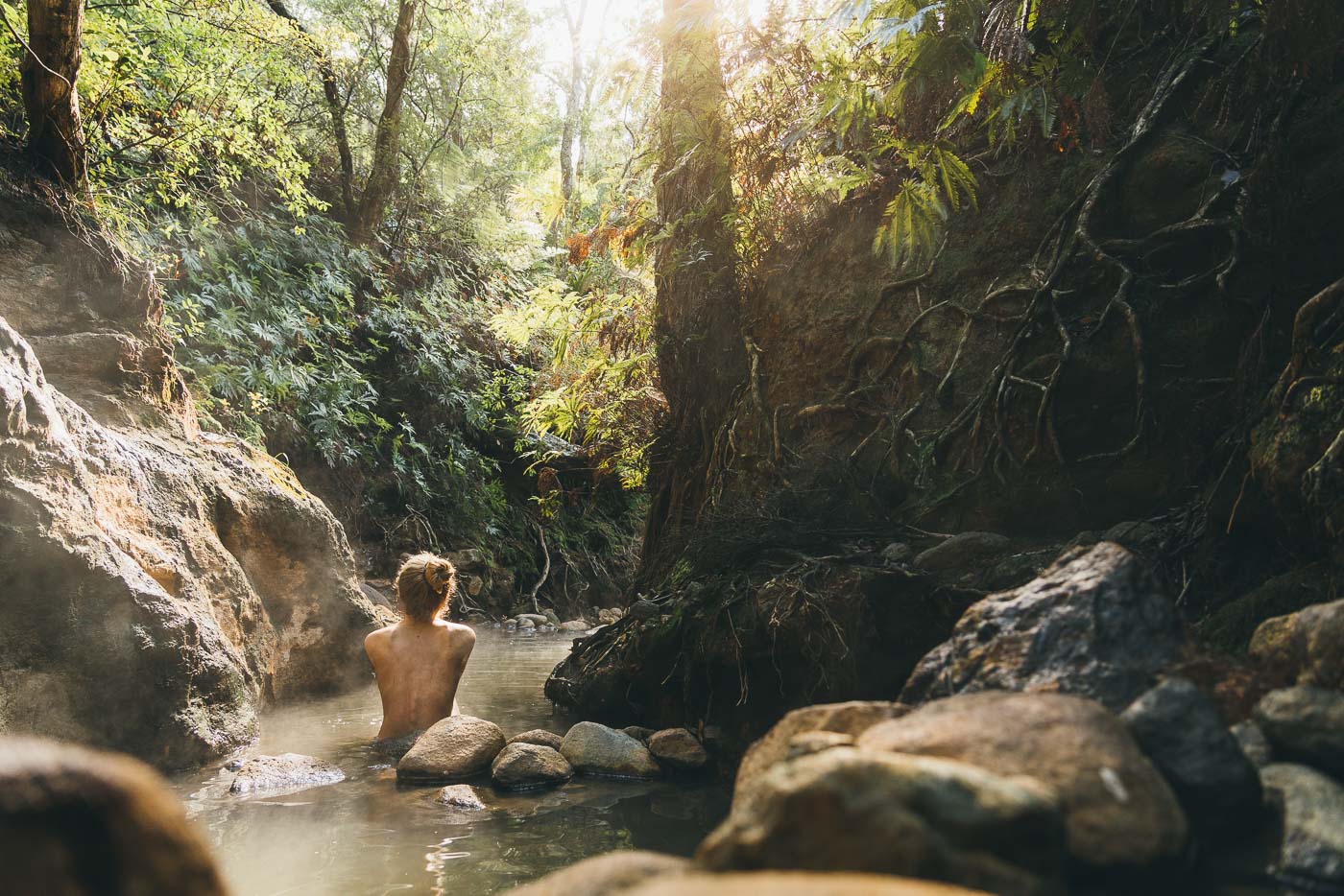 Natural thermal hot pools of Great barrier Island with Jade Barclay. Captured by adventure Photographer Stefan Haworth