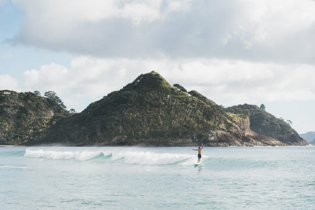 Longboard surfer on Great Barrier Island. Image Captured by Adventure Photographer Stefan Haworth