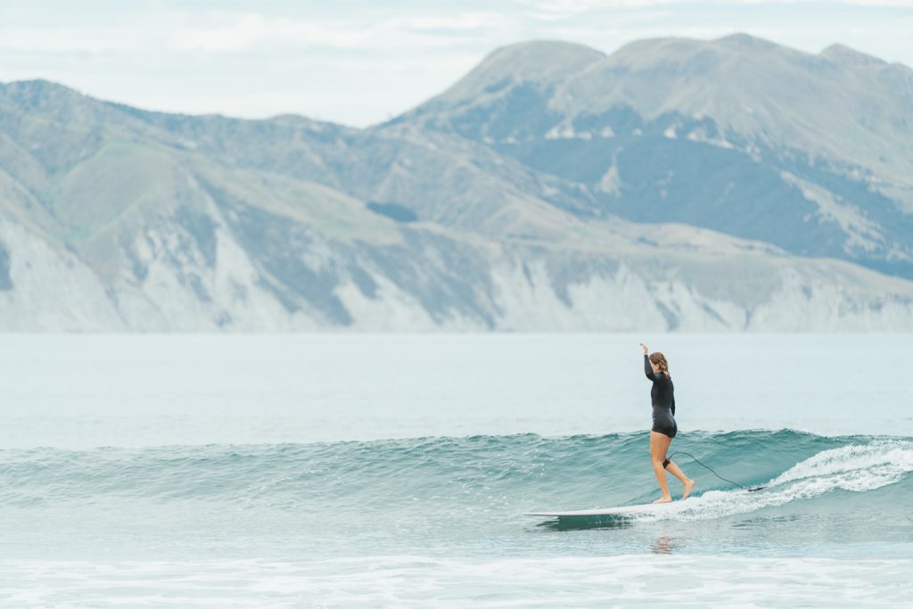 Moa Raud longboarding at Mahia beach in the North Island of New Zealand