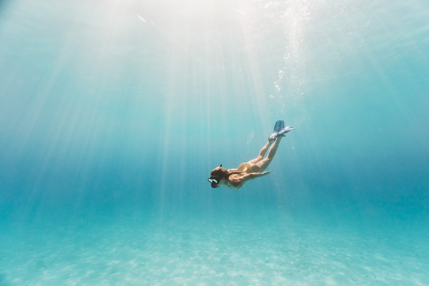 Jade Barclay freediving crystal clear water at Espiritu Santo Island, Vanuatu