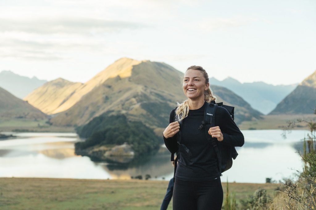 Jade Barclay modelling SS22 Finisterre clothing brand while hiking in southern Alps, New Zealand