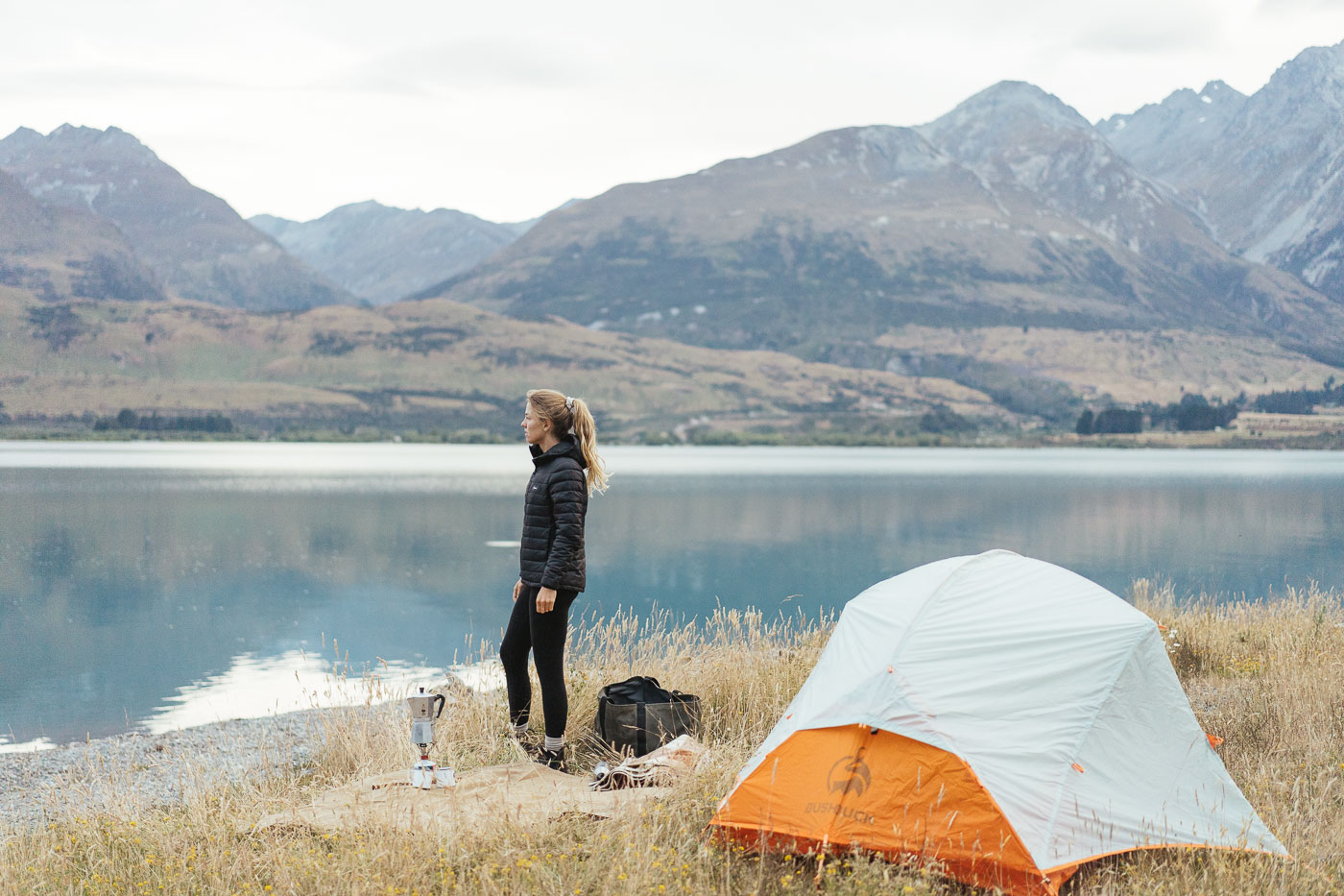 Jade Barclay modelling SS22 Finisterre clothing brand while camping in Glenorchy, New Zealand