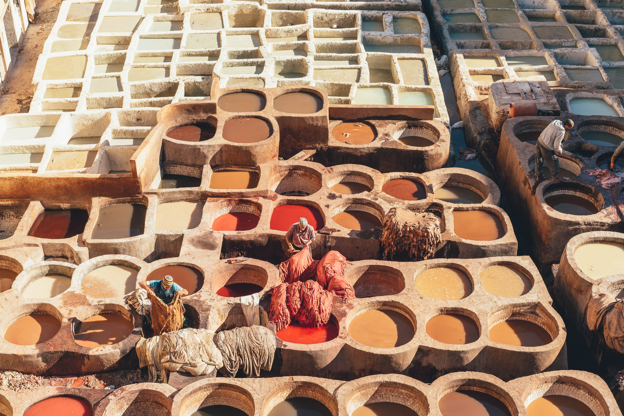 Moroccan Men working at the Tannerie Chouara in Fez, Morocco.