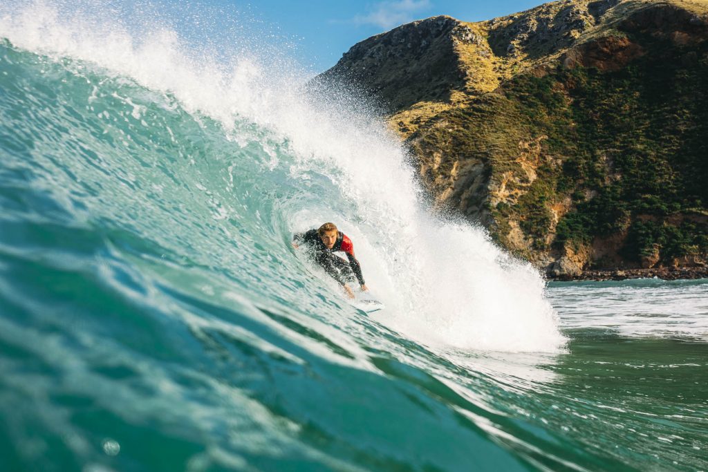 Surfer JC Susan getting barrelled at a dunedin Surf break on the east coast of New Zealand