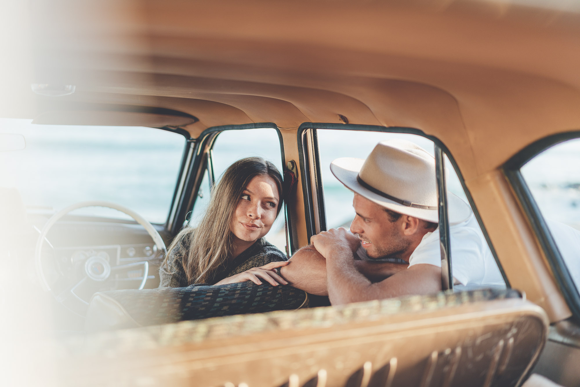 Couple sitting in Vintage car at Byron Bay for Will and Bear in Australia