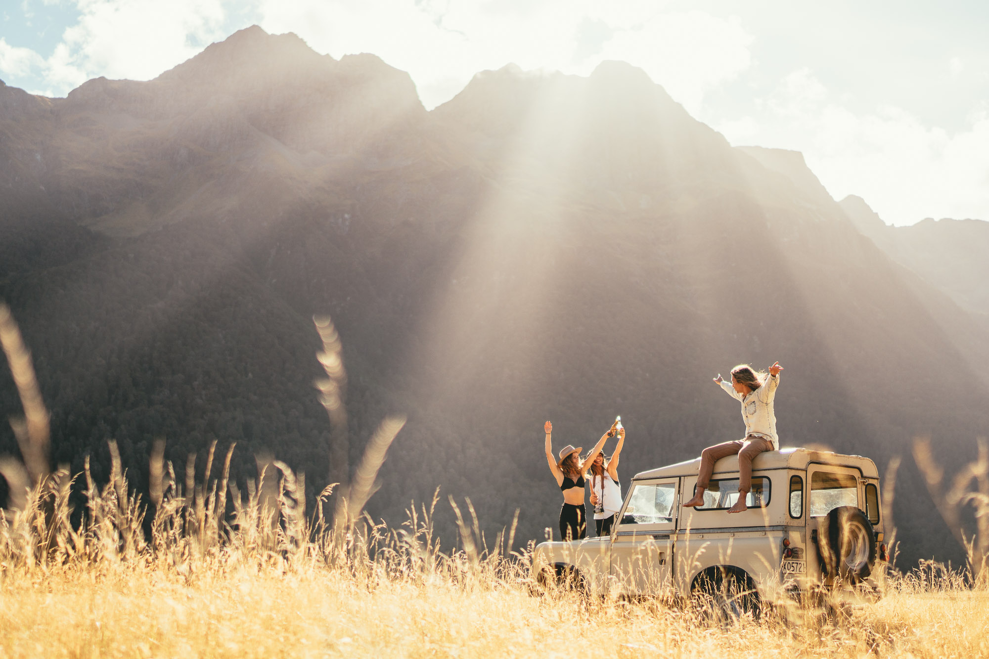 Stefan_haworth_commercial_photographer_Will and Bear Crew celebrating good times amongst the Southern Alps of Fiordland on New Zealand roadtrip_2